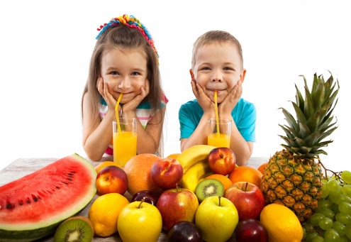 Kids eating vegetables and health food
