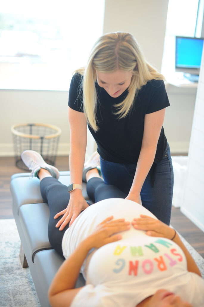 blossom webster certified prenatal chiropractic care appointment with pregnant woman receiving an adjustment