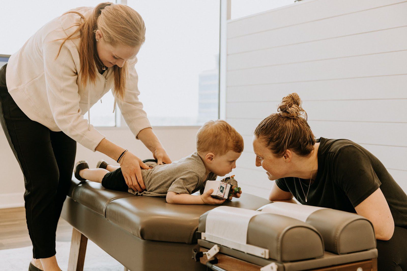 A young child receiving care from a pediatric chiropractor.