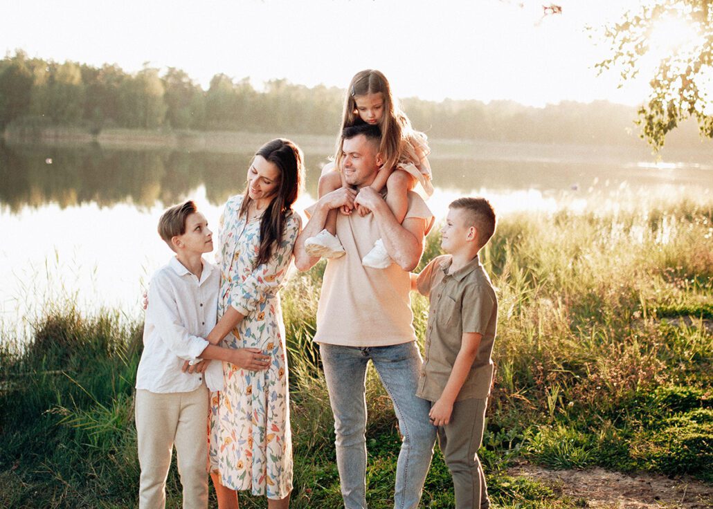 Happy family with young children growing up in St. Petersburg FL, representing family wellness care from birth through the teen years at Blossom Family Chiropractic