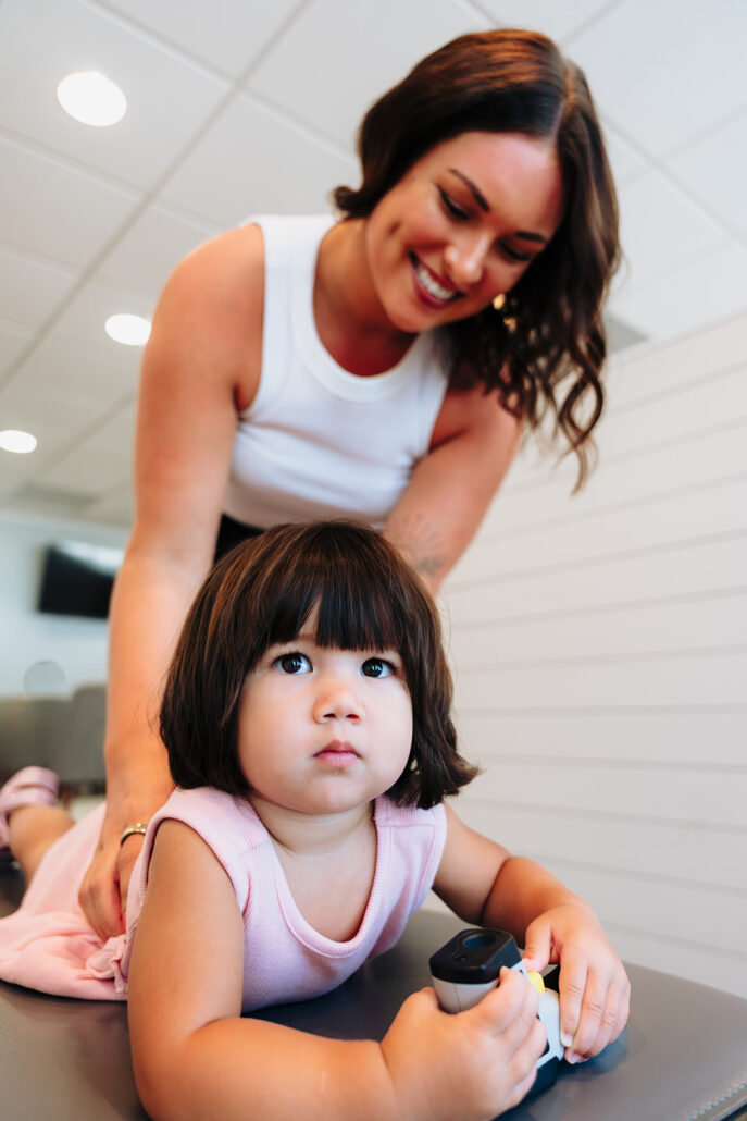 Toddler being adjusted by Dr. Savy at Blossom Family Chiropractic in St. Petersburg, FL