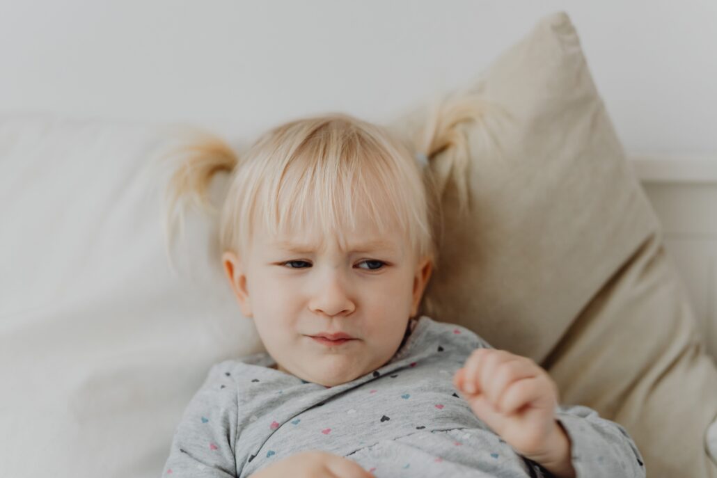 toddler making painful frustrating face because of constipation